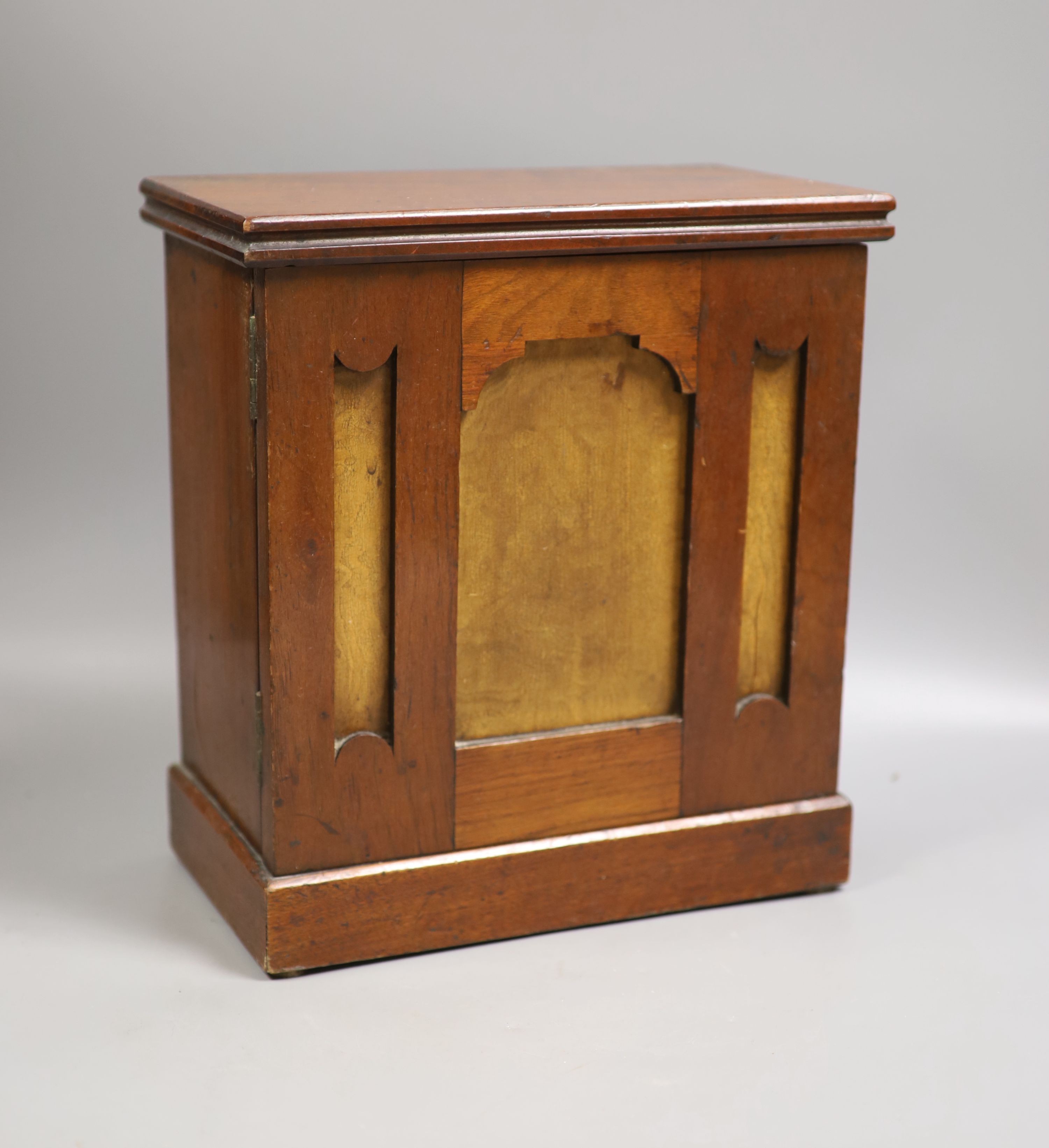 A mahogany coin collector's cabinet, fitted single door enclosing 10 drawers containing British and other coins (Georgian and later), tokens, etc.